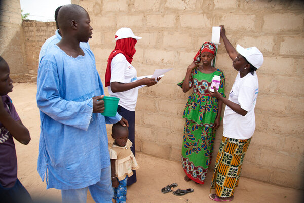 Paying and investing in last-mile community health workers accelerates universal health coverage